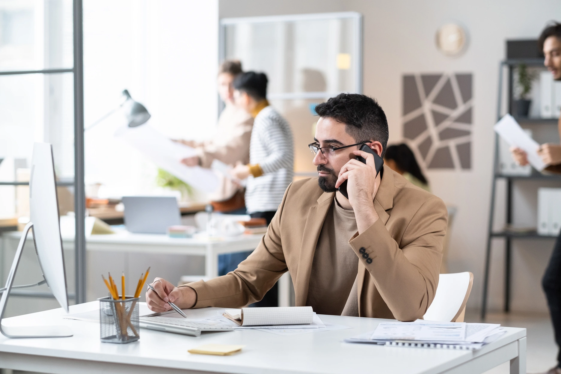serious-businessman-busy-on-the-phone-2023-11-27-05-20-26-utc businessman on a call